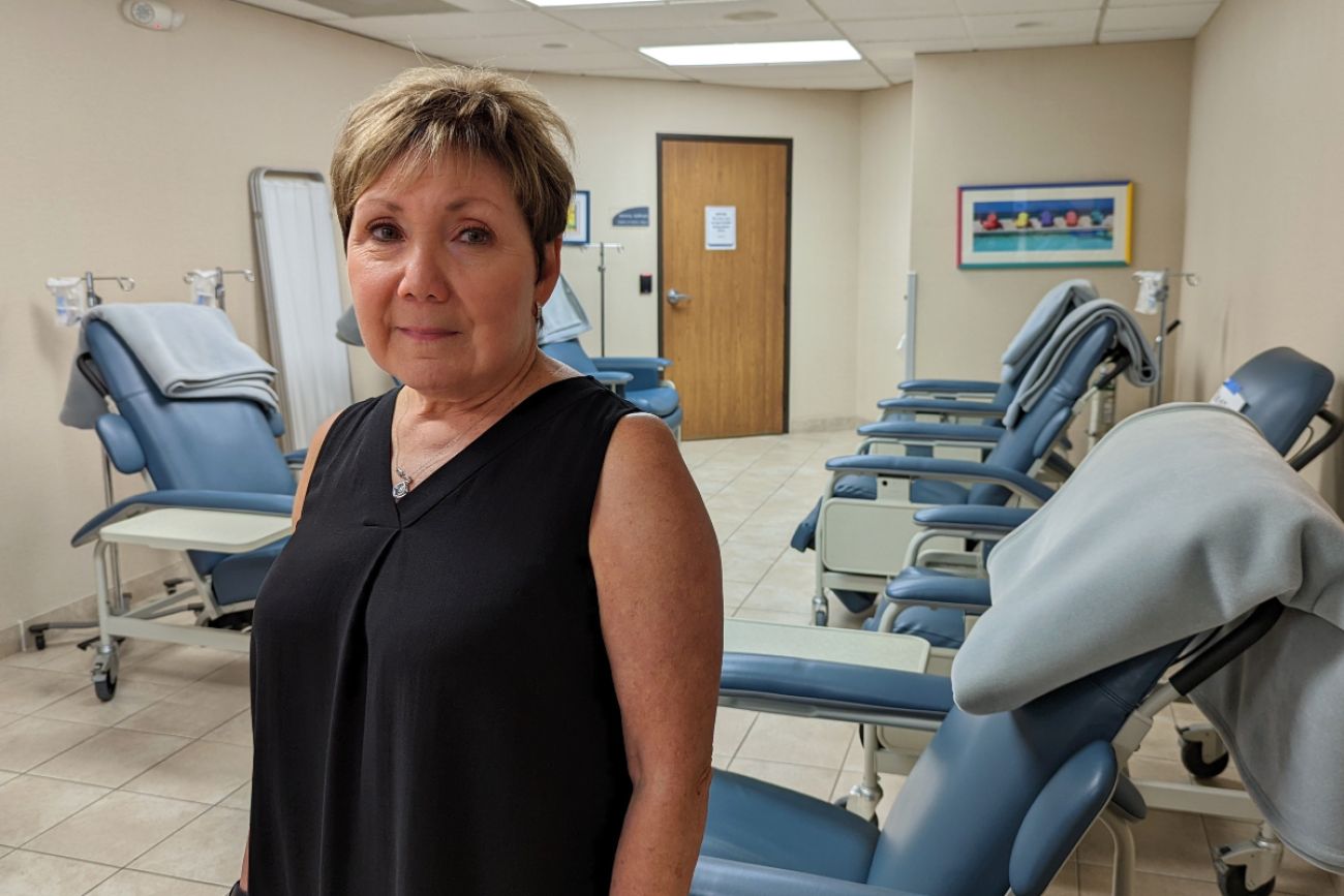 Woman stands in doctor's office