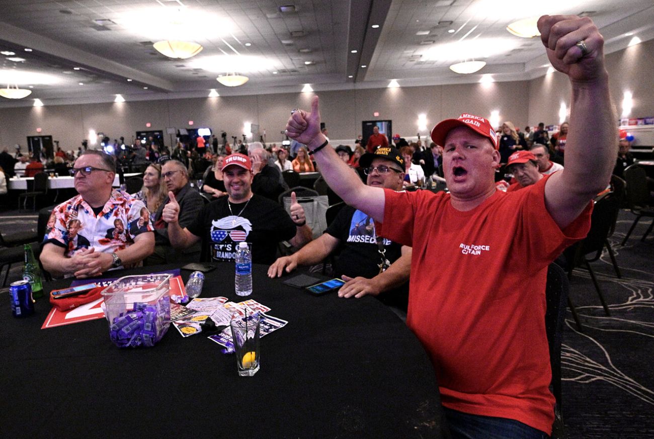 People cheering in a room