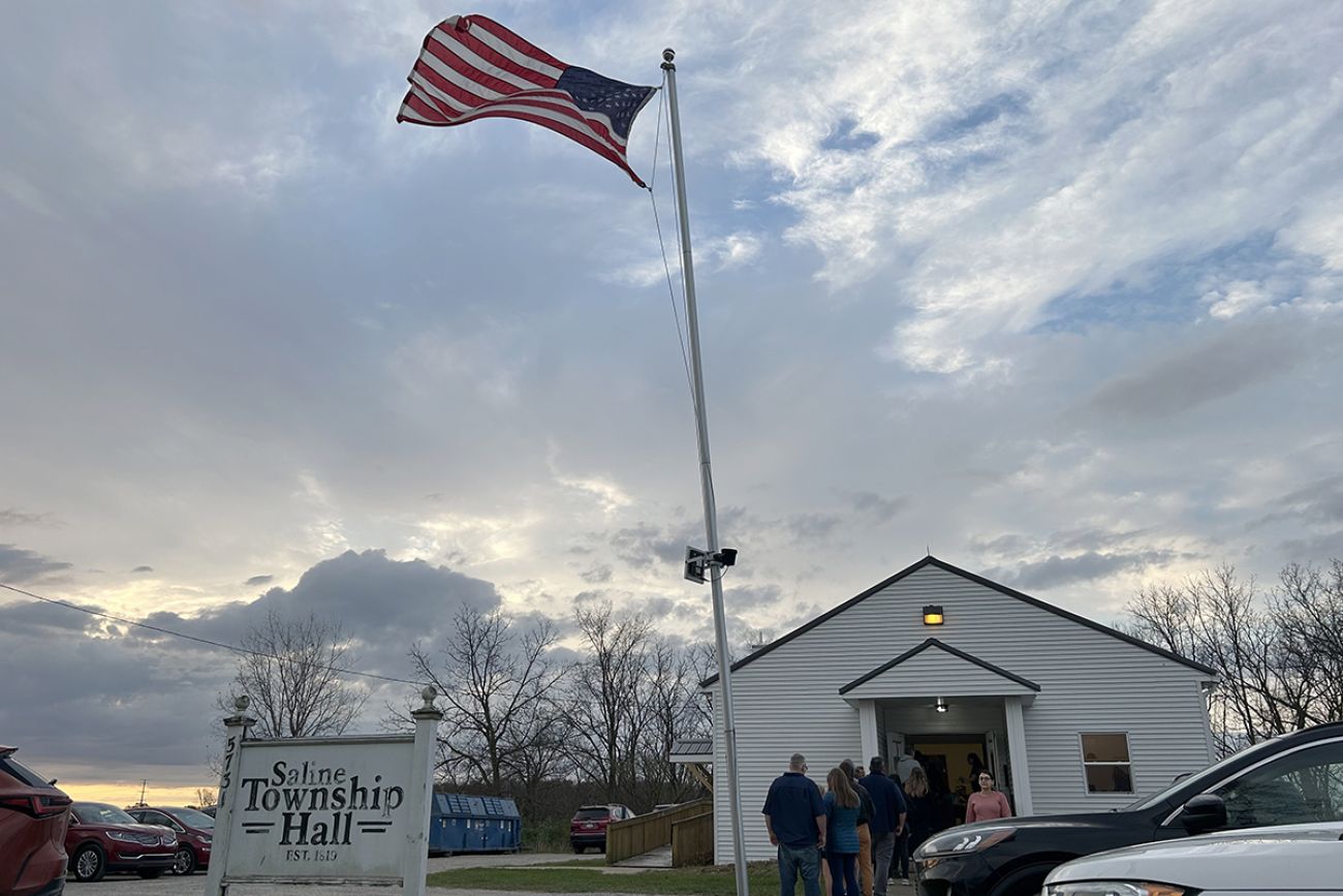 People standing outside Saline Township hall