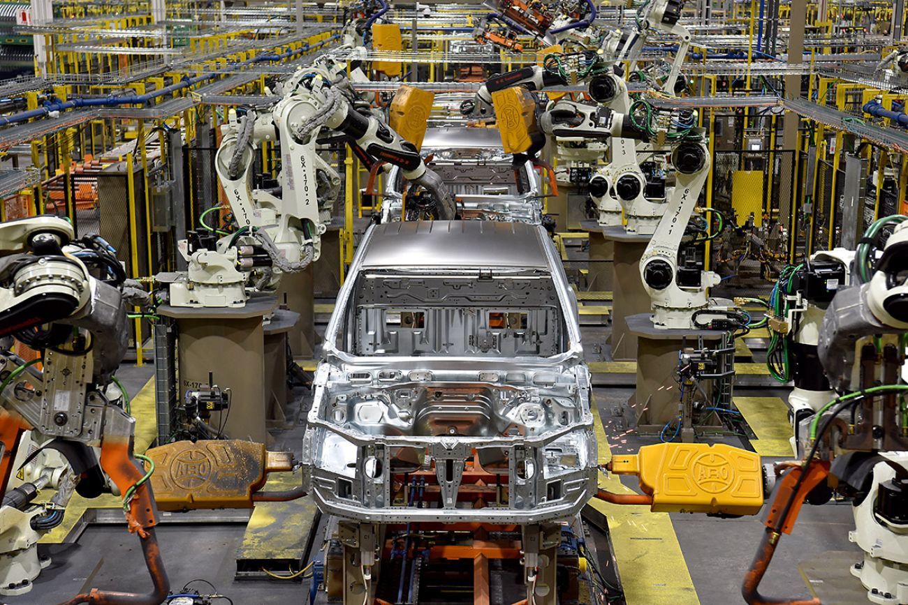 A car being produced in an assembly plant.