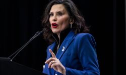 Gov. Gretchen Whitmer speaks into a microphone. 