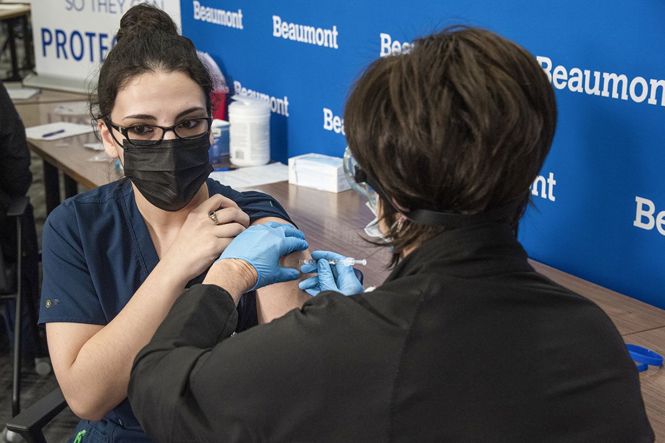 person getting vaccine