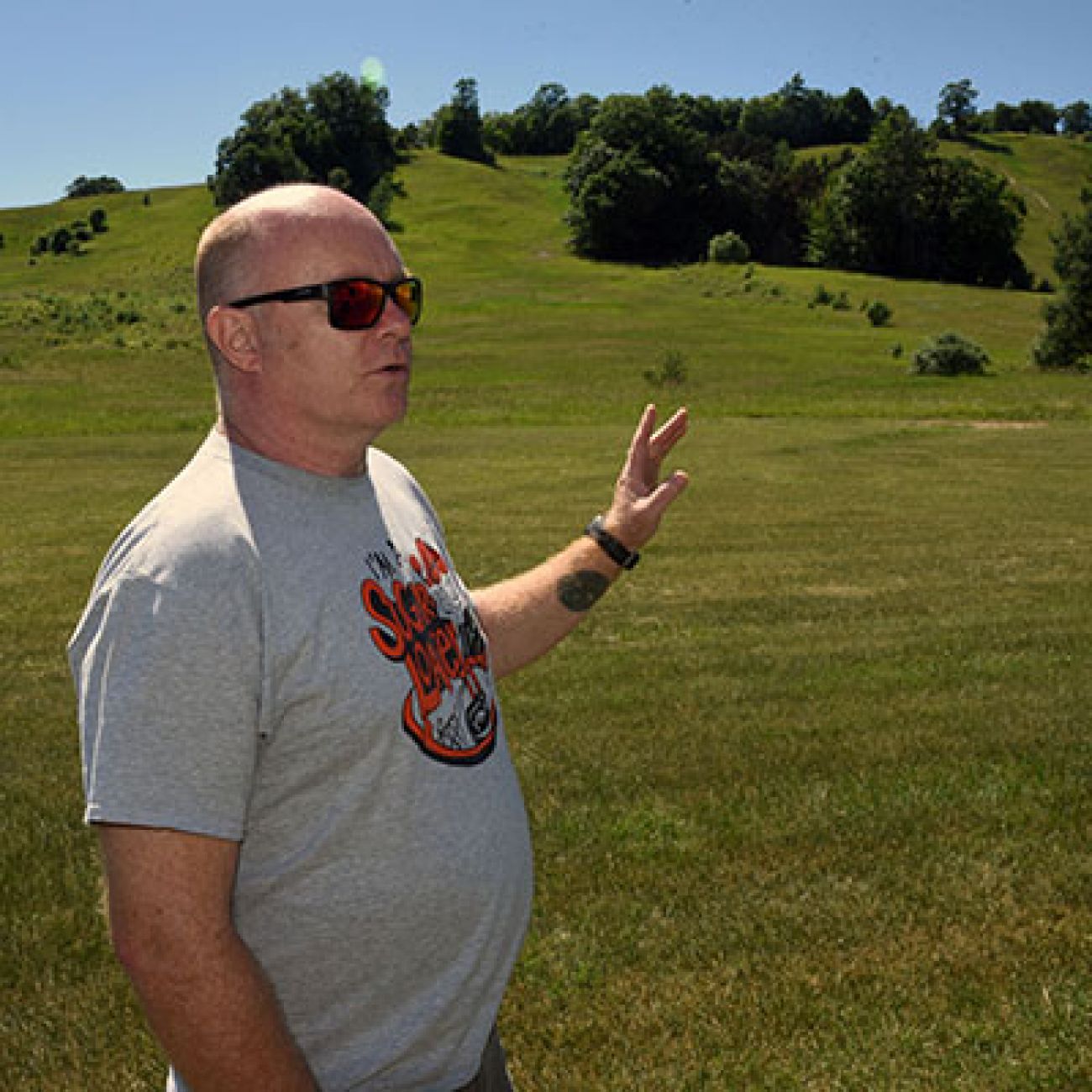 man in front of hill