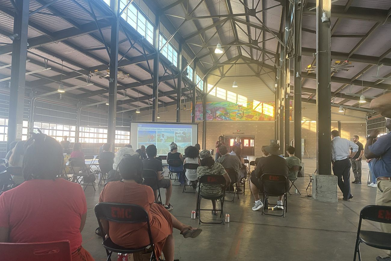 people sitting in chairs at meeting