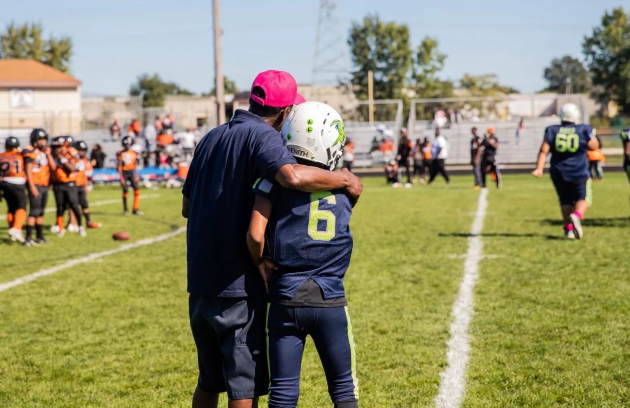 coach hugging player