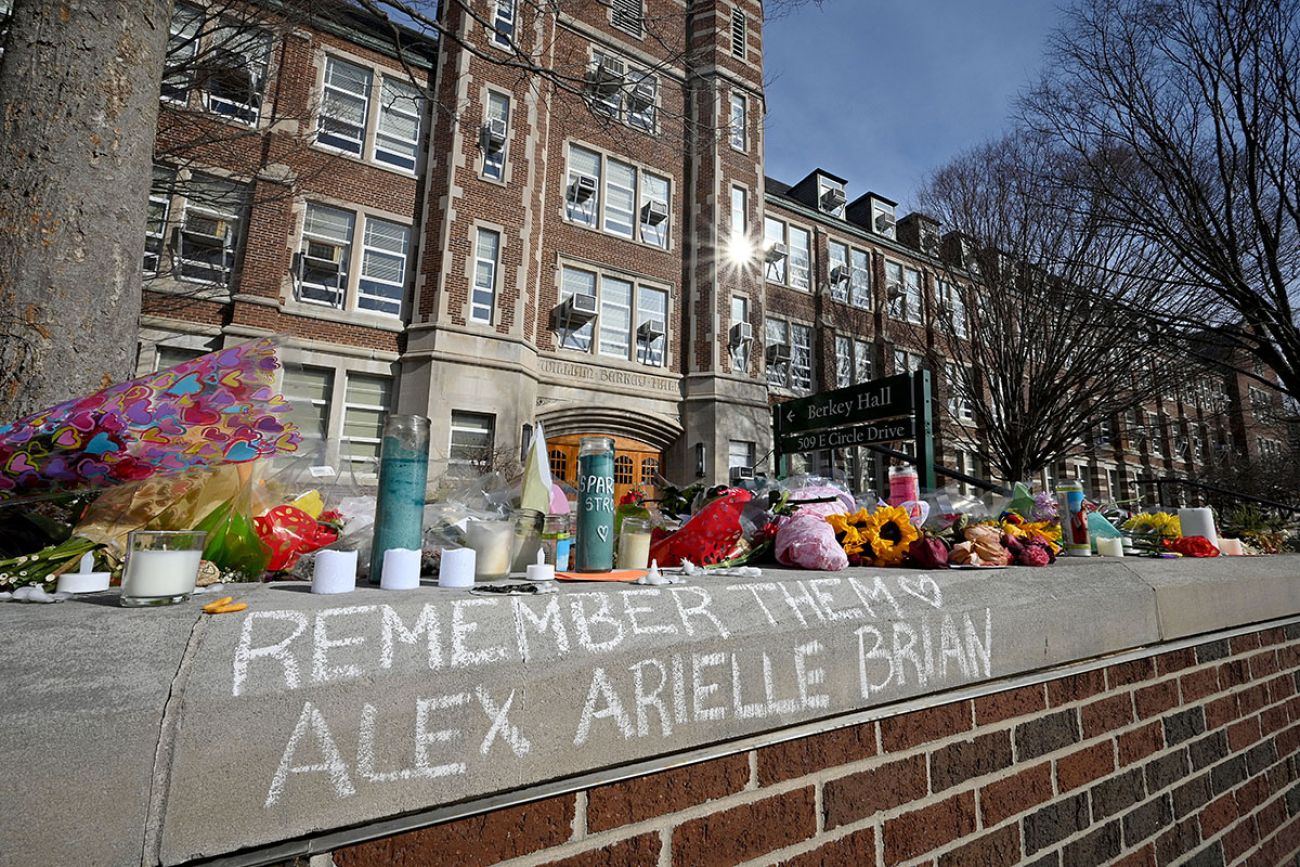 written in chalk "remember them Alex, Arielle and Brian"