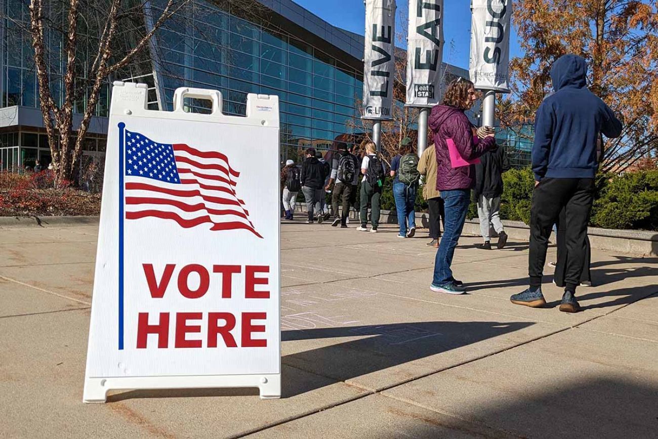 young people lining up to vote