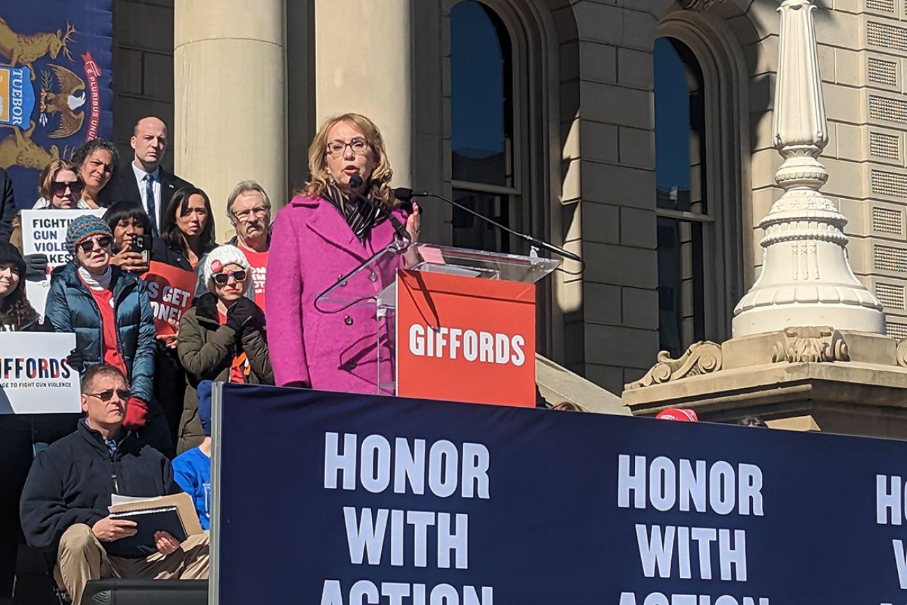 Former U.S. Rep. Gabby Giffords talking to crowd with people behind her