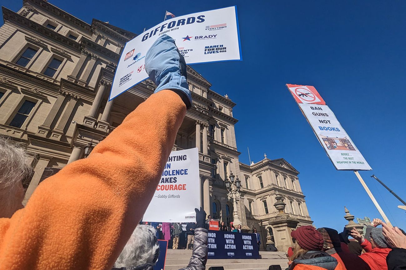 people holding signs