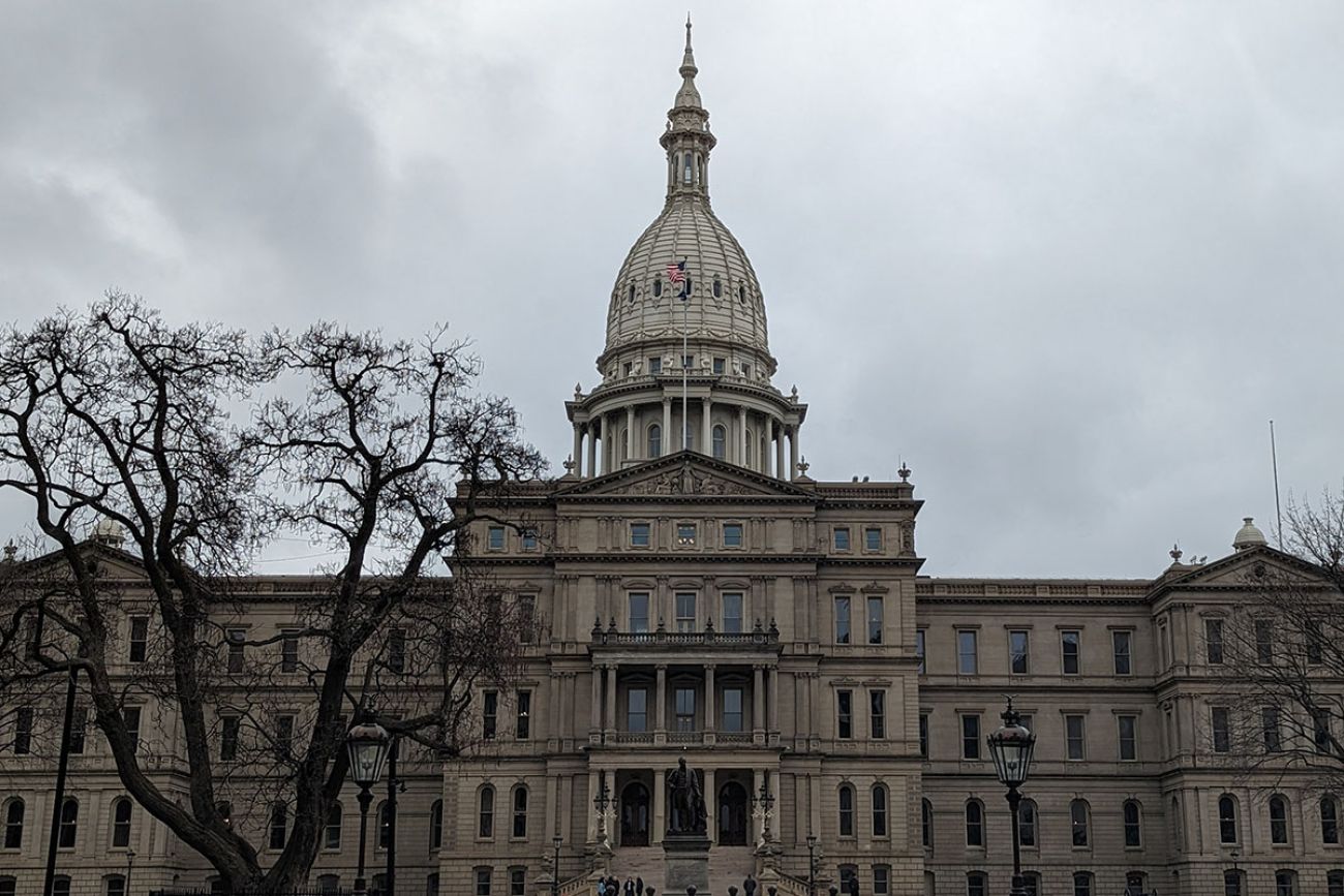 outside the Michigan capitol building on a cloudy day