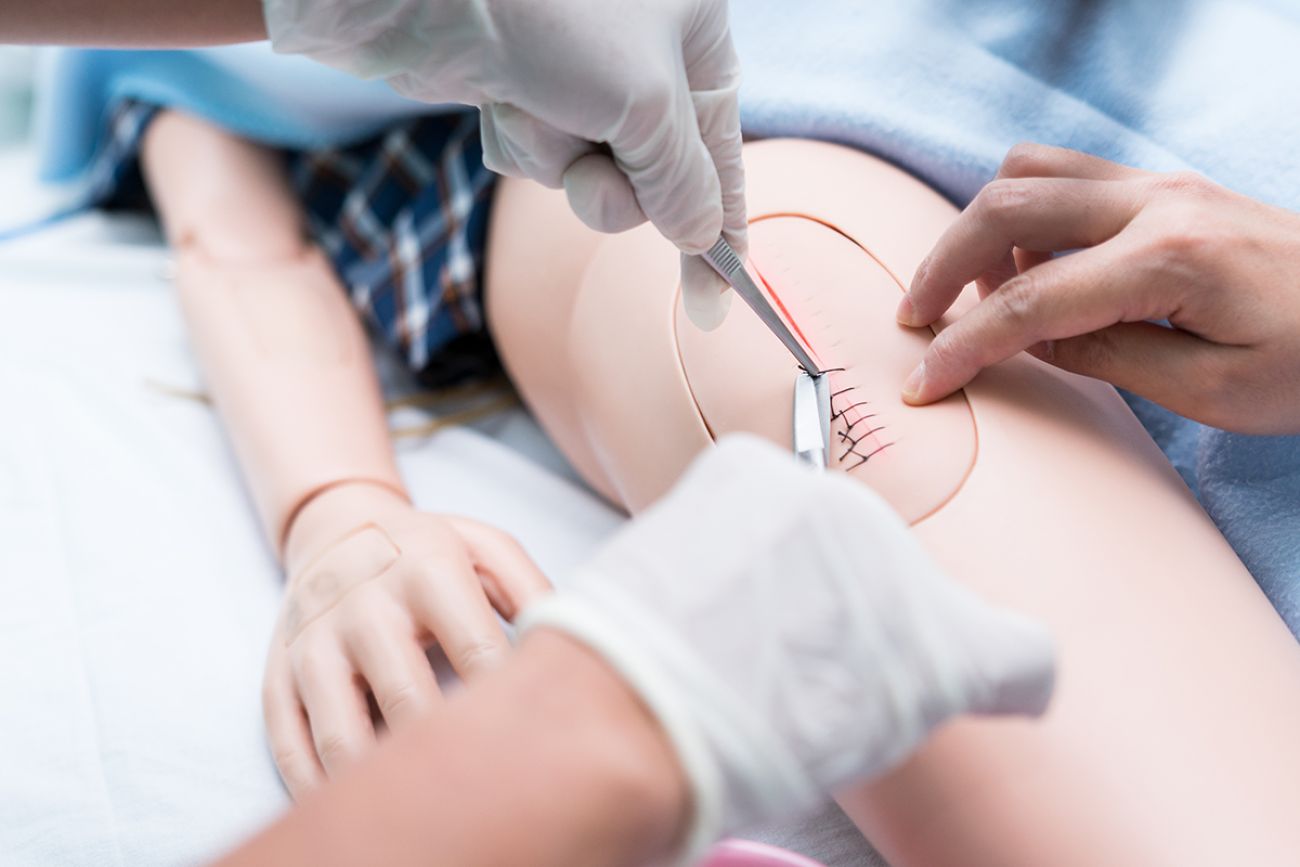 Nursing student were trained how to stitch off with suture wound of the patient. She practice training with the Doll of patient, Before treatment to the real patient.