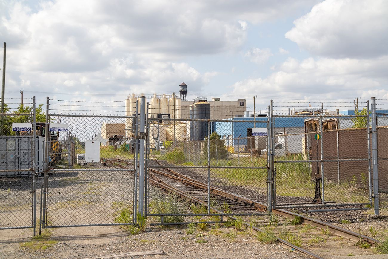 work site behind a wire fence