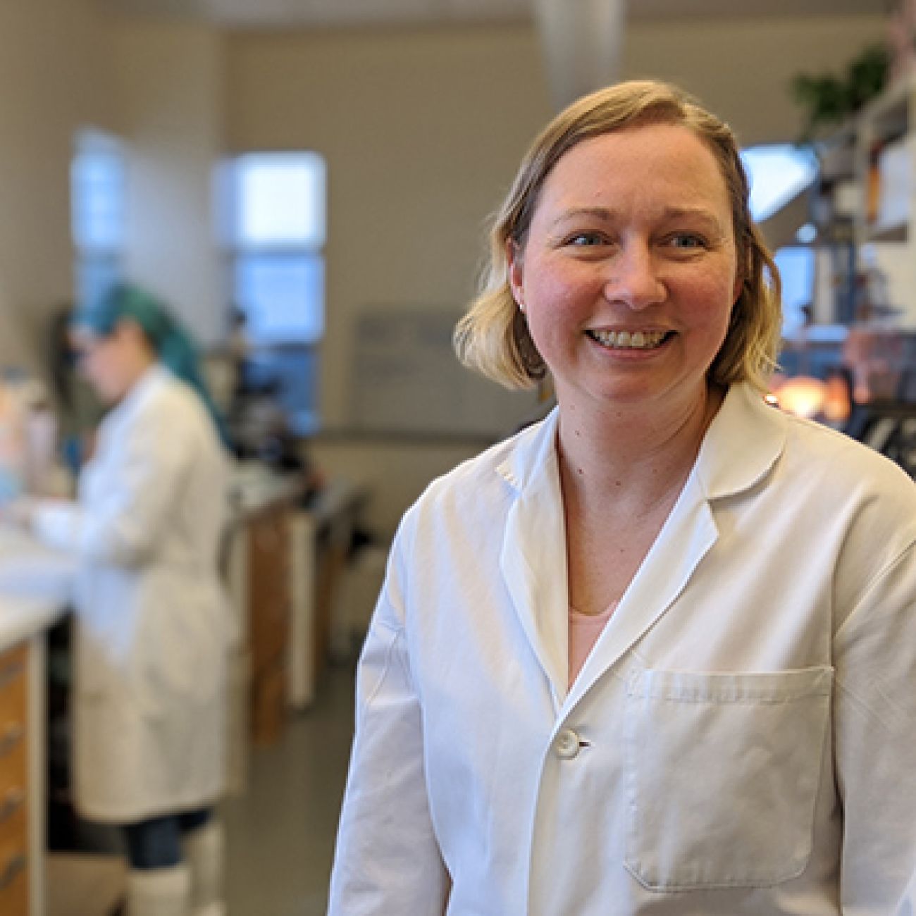 Emily Toth-Martin in a lab coat