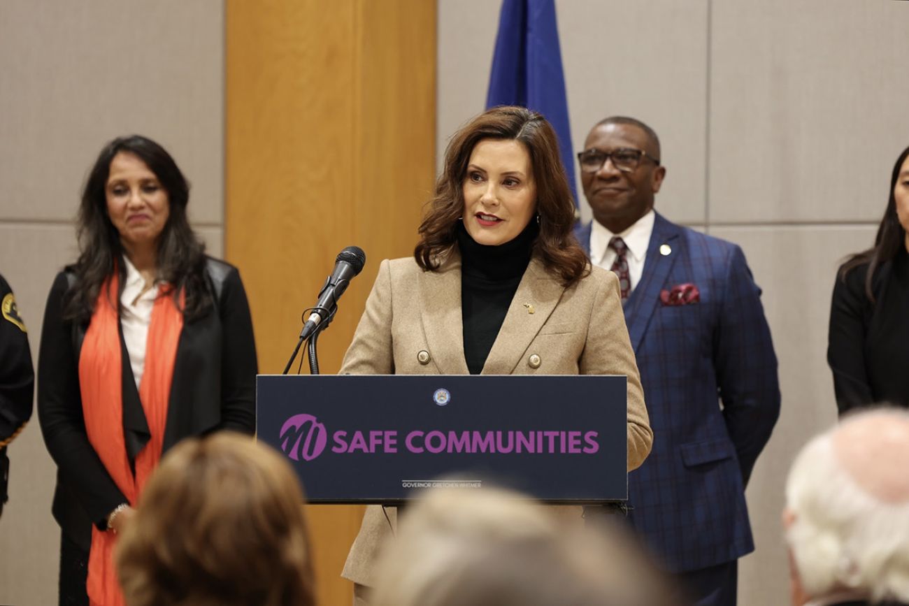 Gov. Gretchen Whitmer speaking into a microphone