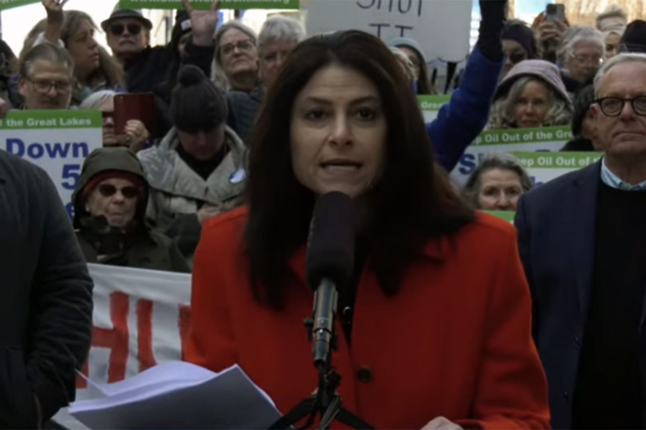 Attorney General Dana Nessel speaking into microphone