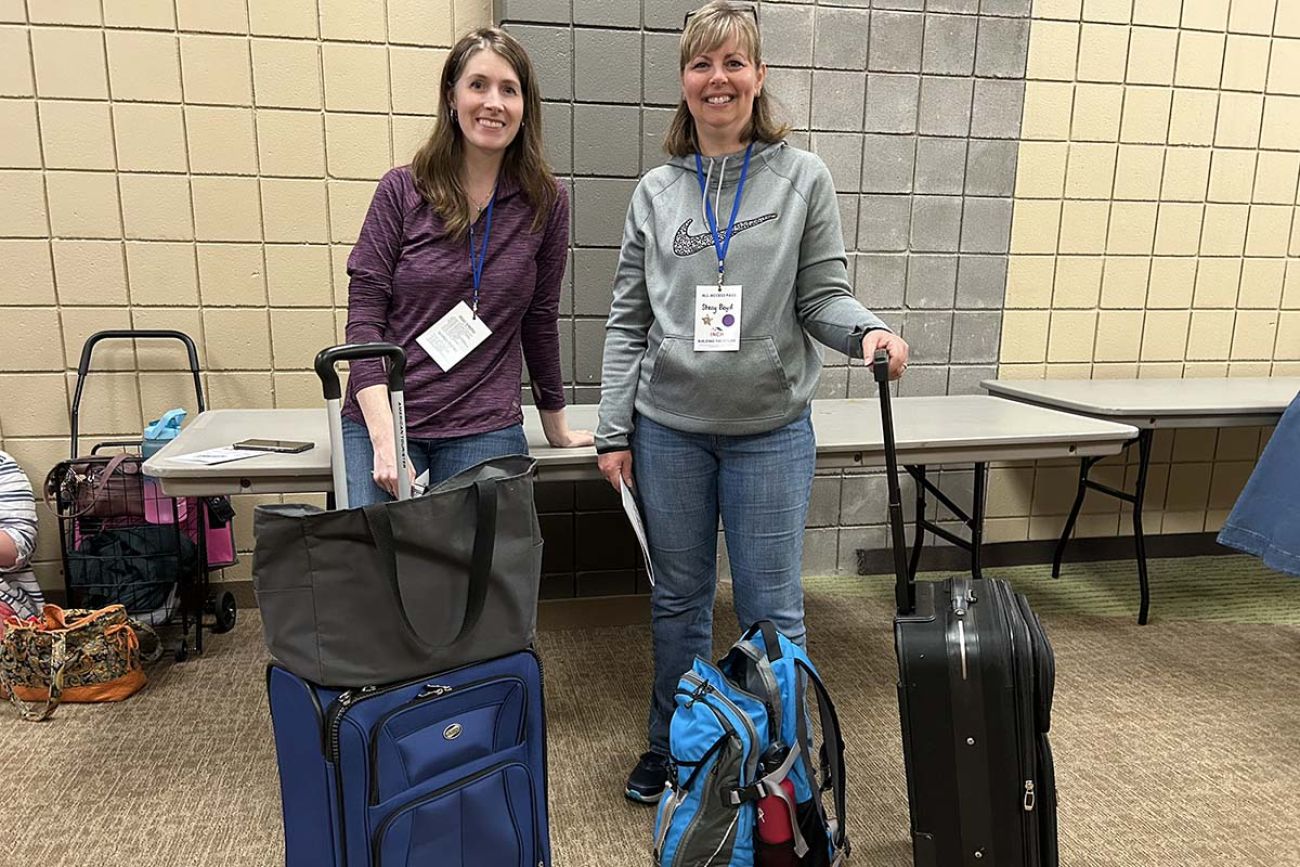 two women with suitcases