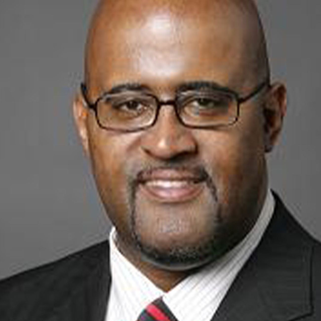 Ken Cockrel Jr. headshot. He is wearing a suit 