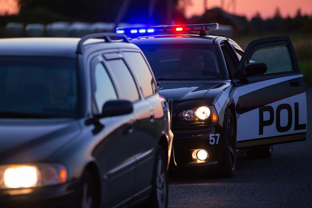 Highway Traffic Patrol Car Pulls over Vehicle on the Road