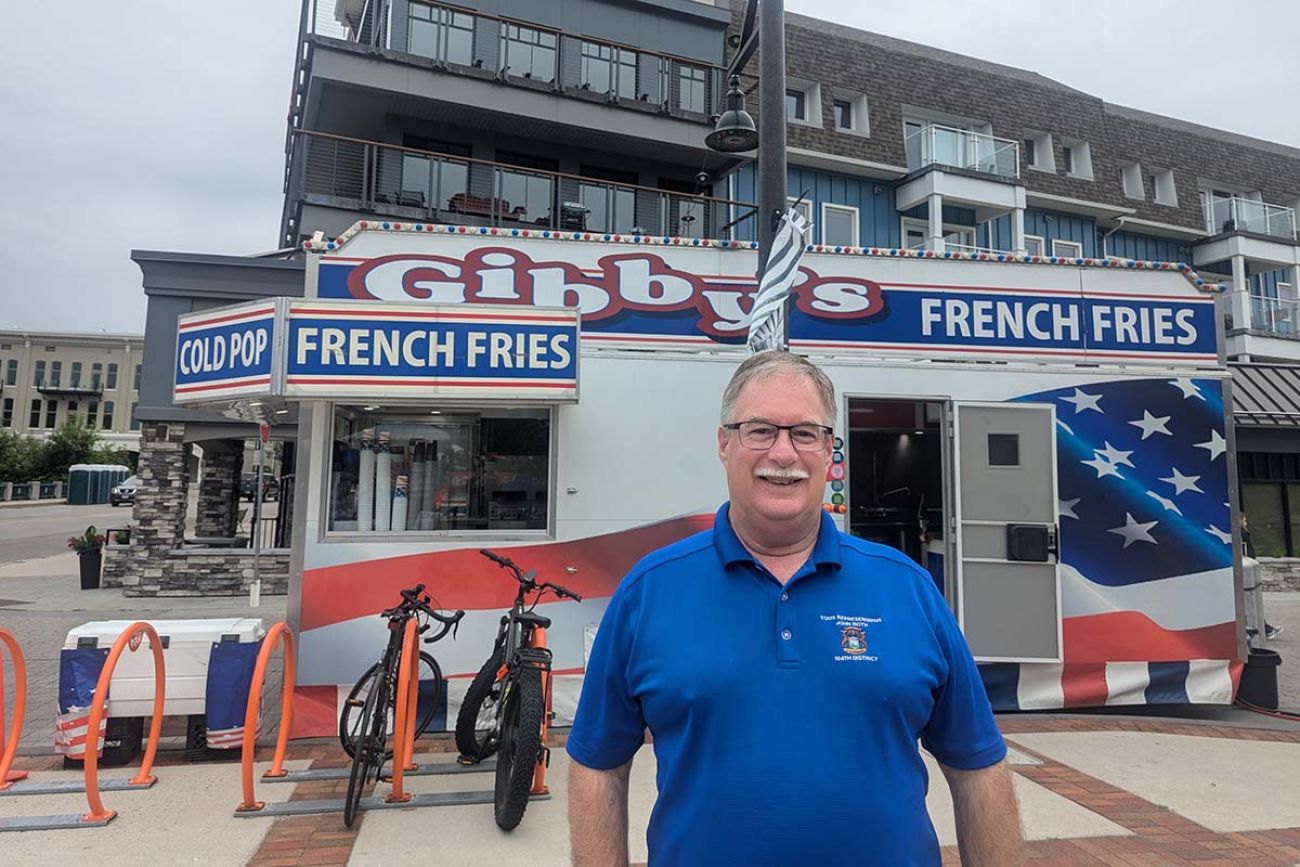 Rep. John Roth, R-Interlochen, posing for a picture outside. He is wearing a blue polo shirt