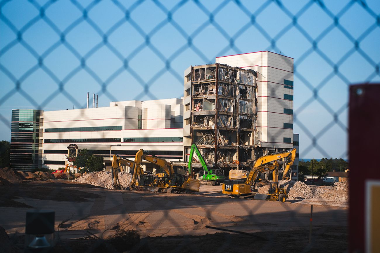 A building being demolished. You can still see some of the building, a couple of tracks