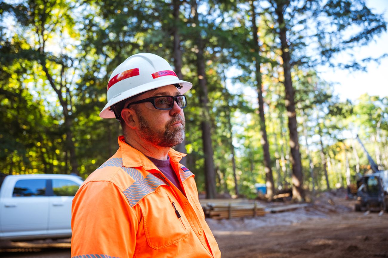 Steve Hovis, general manager of exploration for Talon Metals, is wearing a white hard hat and orange shirt