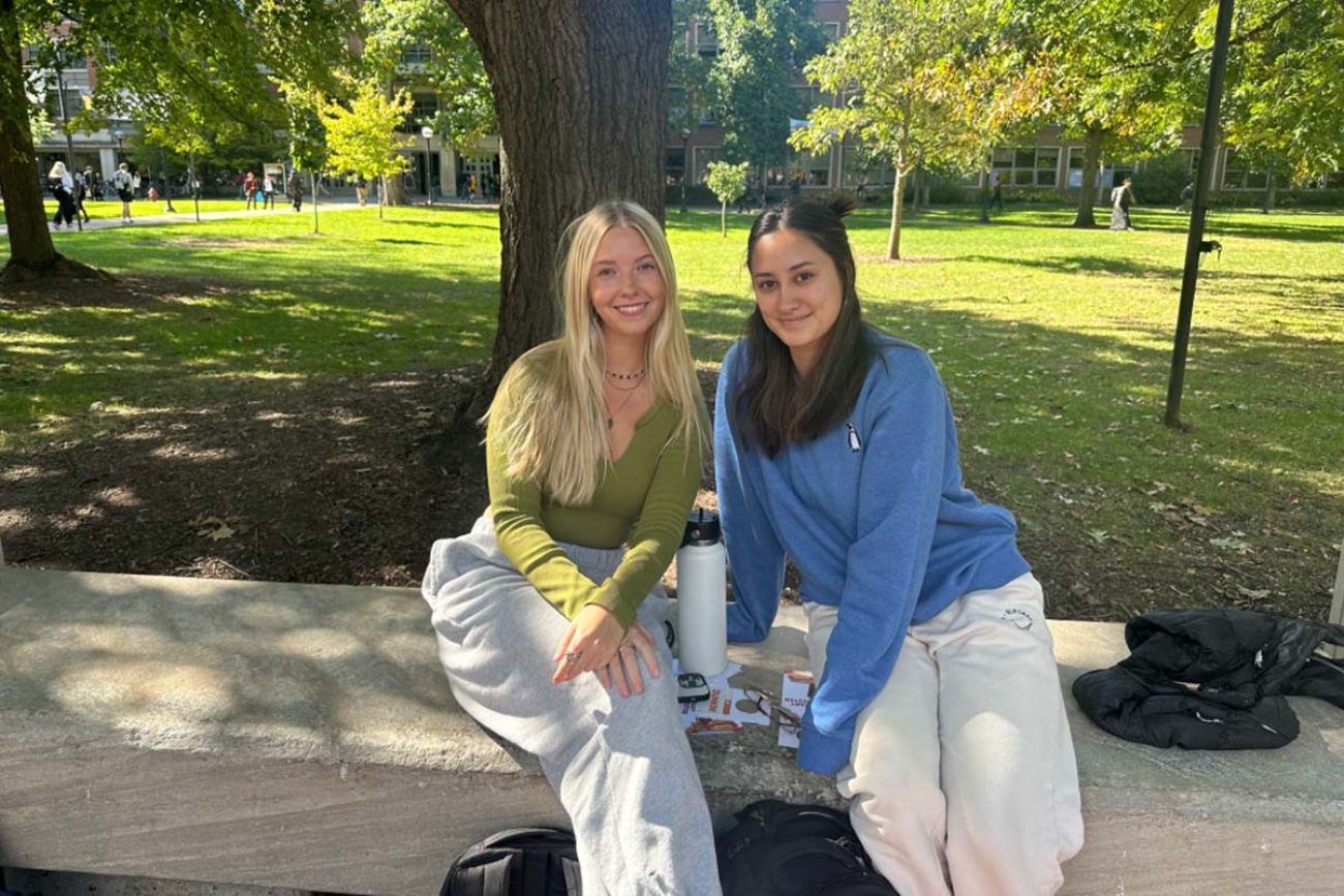 Two college students on a bench