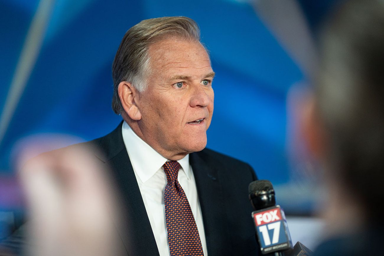 Republican U.S. Senate candidate Mike Rogers speaks into a microphone