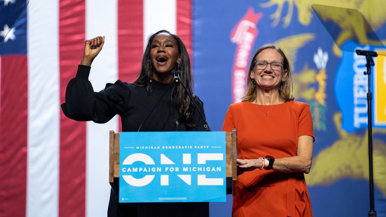 Incumbent Justice Kyra Harris Bolden and Kimberly Ann Thomas on a stage