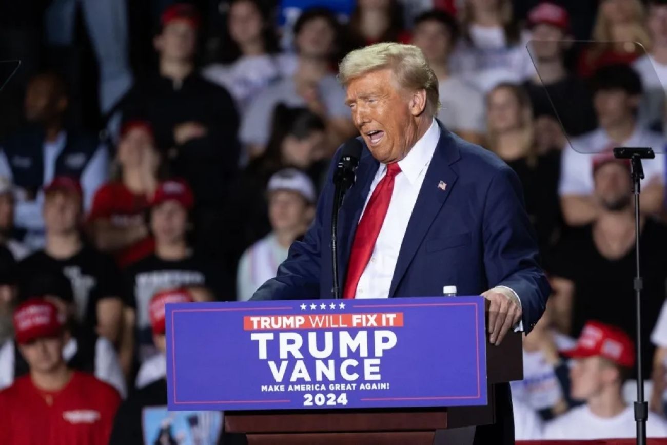 Donald Trump on stage at a rally in Grand Rapids