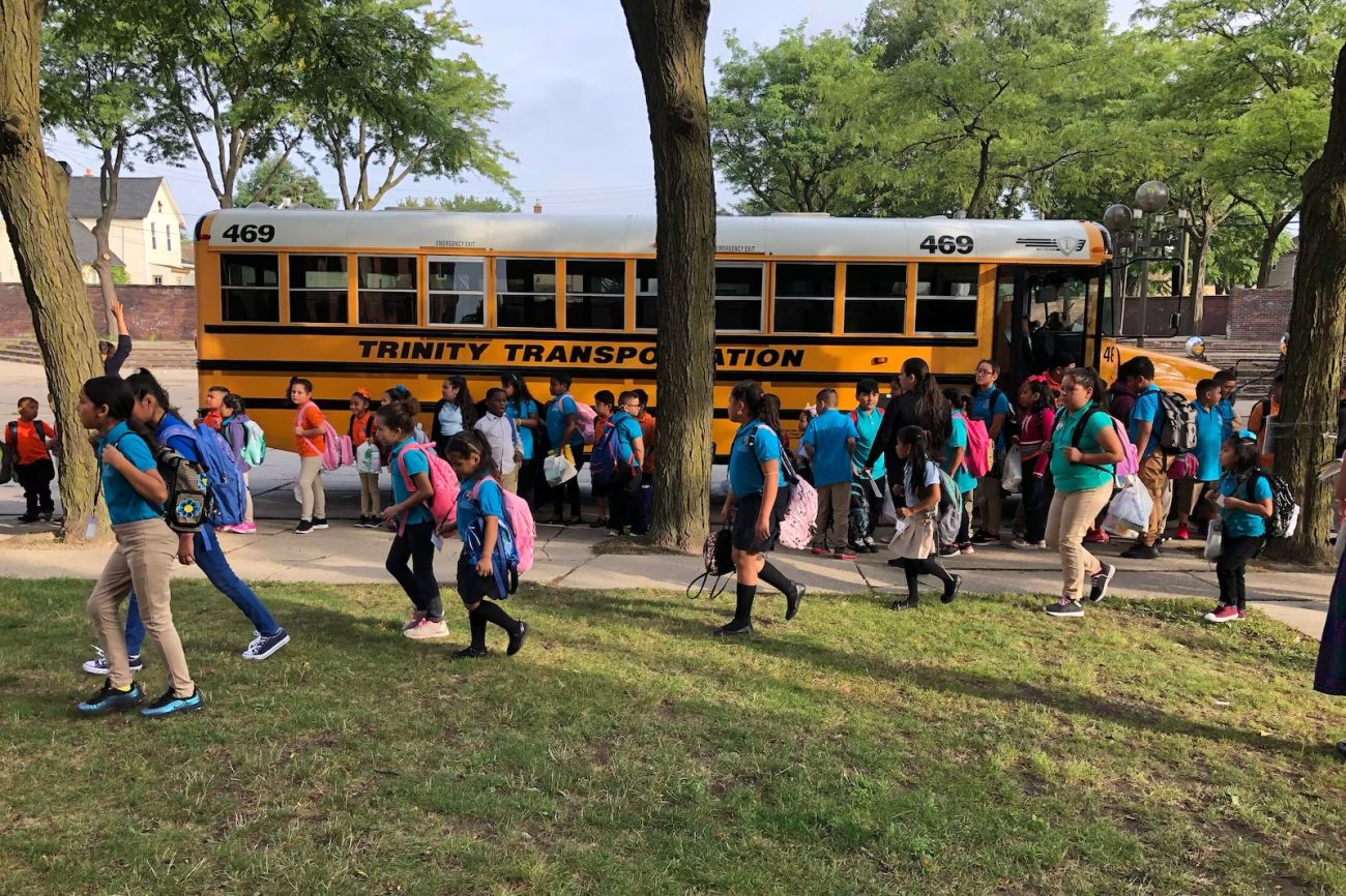 Kids coming out of a school bus