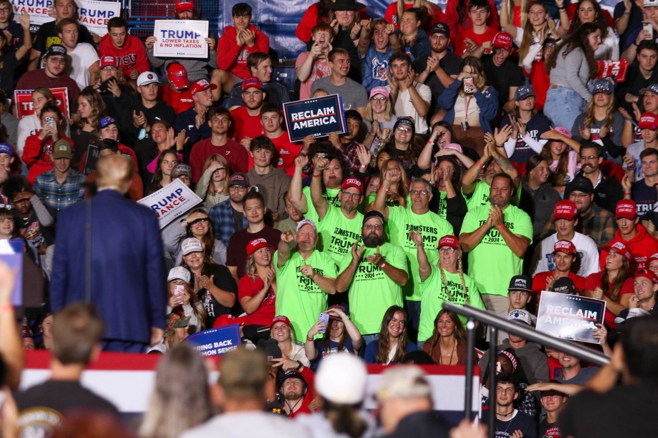 Donald Trump speaks to a crowd at a rally in Saginaw 