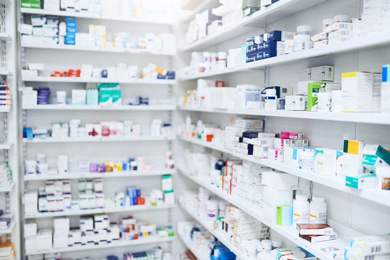 Pharmacy, pills and box with healthcare store, shelf and prescription care medicine. 