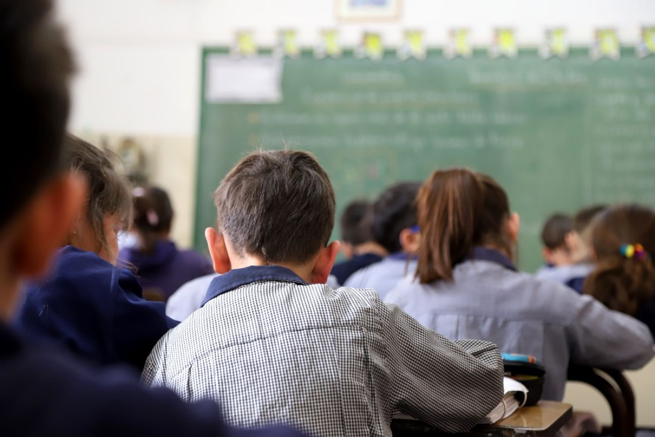 Kids sit in classroom