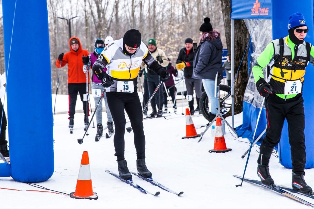 Cross-country skiers in Gaylord. The ground is covered in snow. 