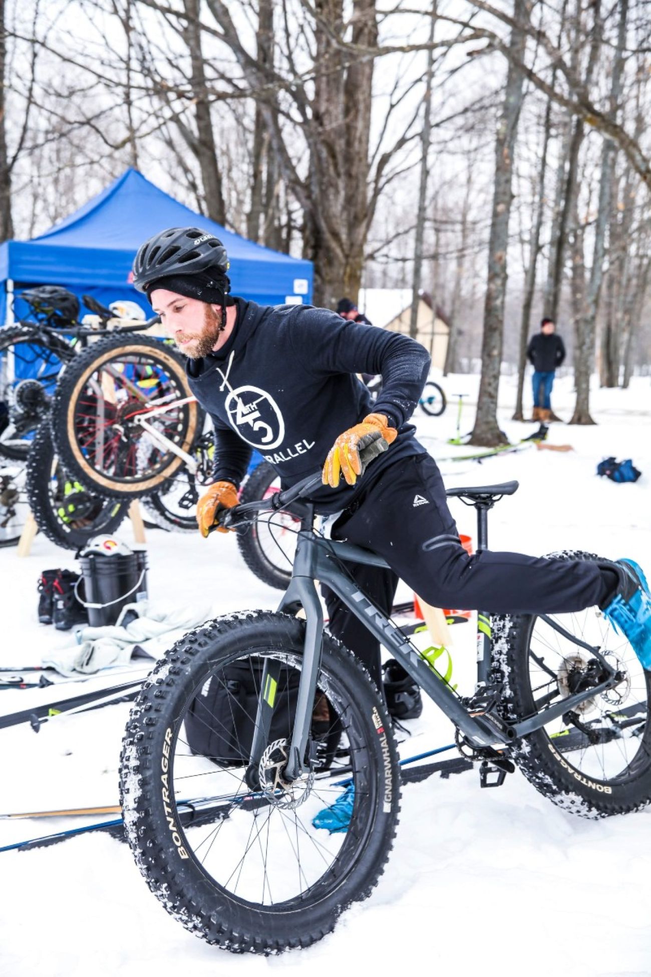 A fat-tire bicyclist in Gaylord. There's a lot of snow on the ground. 