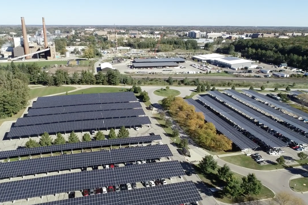 A screenshot of drone footage of solar-powered carports at Michigan State University. 