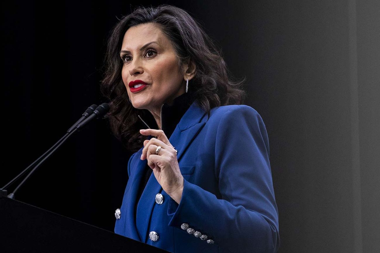 Michigan Gov. Gretchen Whitmer speaking into a microphone. 