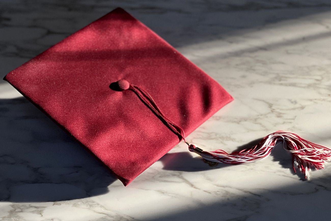 A red graduation hat. 