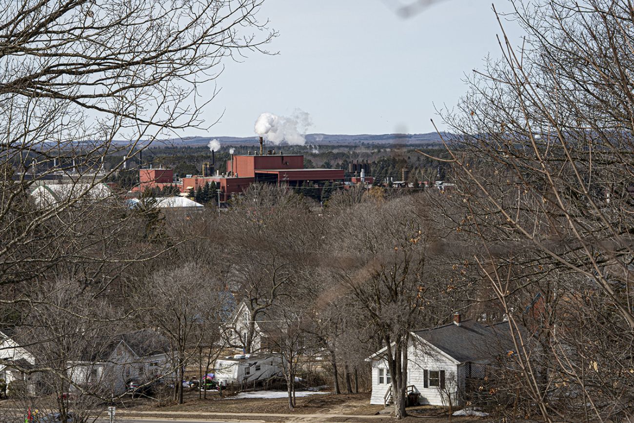 An aerial image of the Cadillac Industrial Park in Michigan. You can see a red industrial building and residental homes 