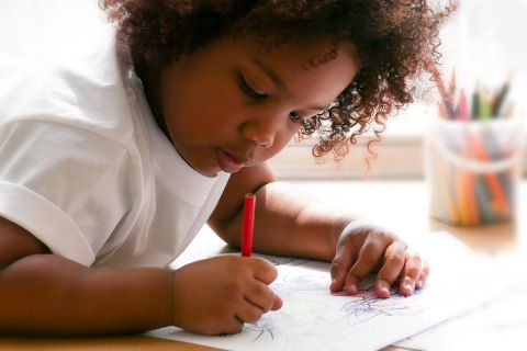 young girl coloring