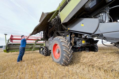 man working on tractor