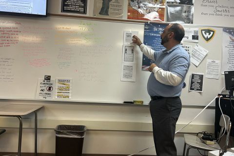 teacher looking at a whiteboard