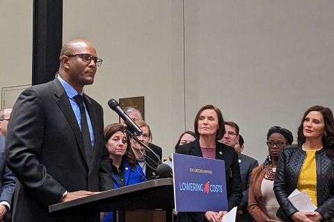 Joe Tate speaking into a microphone