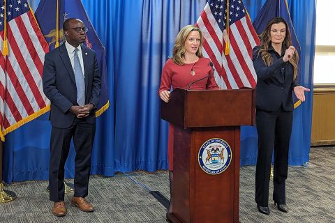 Secretary of State Jocelyn Benson speaking at a podium