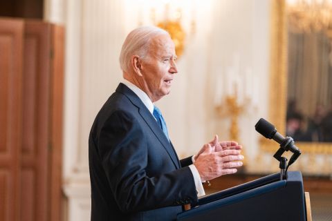 President Joe Biden stands at a podium