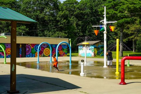 Two kids enjoying a splash pad