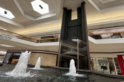 The elevator in Lakeside Mall. You can also see a fountain.