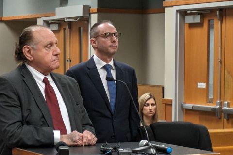 Rob Minard (center) and Anne Minard (back right) in court next to their attonery