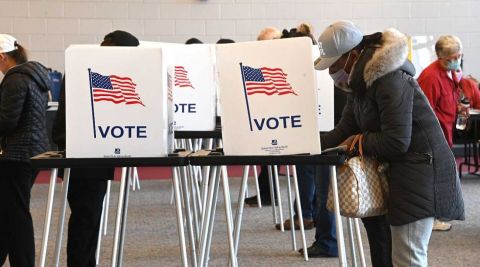 People at voting booths