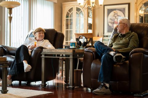 Dr. Arnold Beresh and Michele Beresh sitting in chairs in the living room